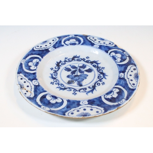 13 - Pair of 18th century delft blue and white plates with floral decoration, diameter approx. 23.5cm