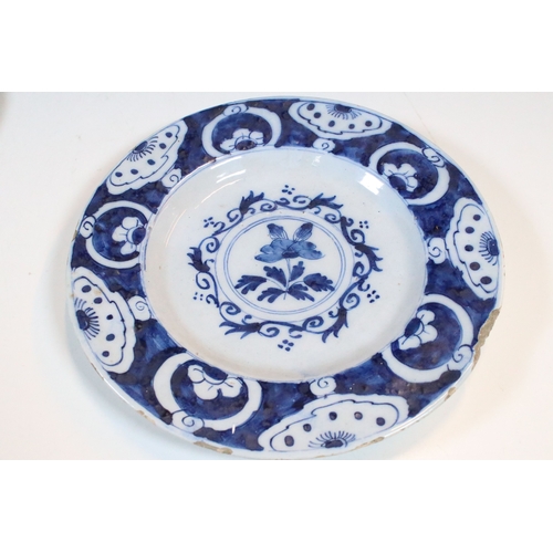 13 - Pair of 18th century delft blue and white plates with floral decoration, diameter approx. 23.5cm