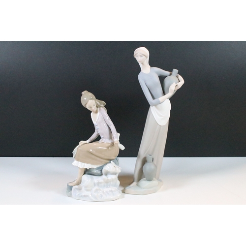 27 - Lladro Nao 'Girl carrying water jar' bisque finish figurine, H 32cm together with Lladro 'Girl at th... 