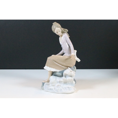 27 - Lladro Nao 'Girl carrying water jar' bisque finish figurine, H 32cm together with Lladro 'Girl at th... 