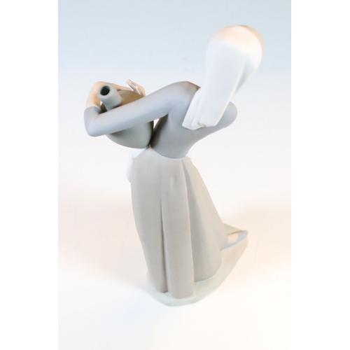 27 - Lladro Nao 'Girl carrying water jar' bisque finish figurine, H 32cm together with Lladro 'Girl at th... 