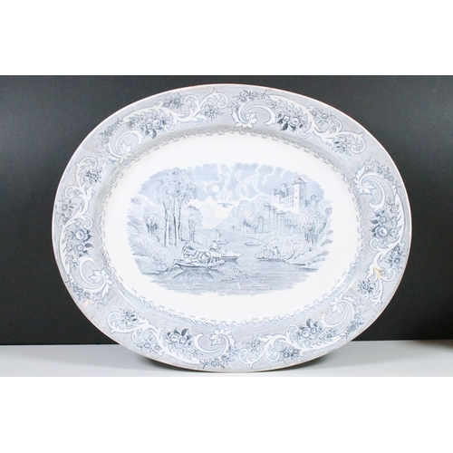 28 - Early 20th century transferware grey and white oval meat platter charger 45cm, together with two sau... 
