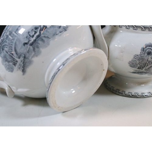 28 - Early 20th century transferware grey and white oval meat platter charger 45cm, together with two sau... 