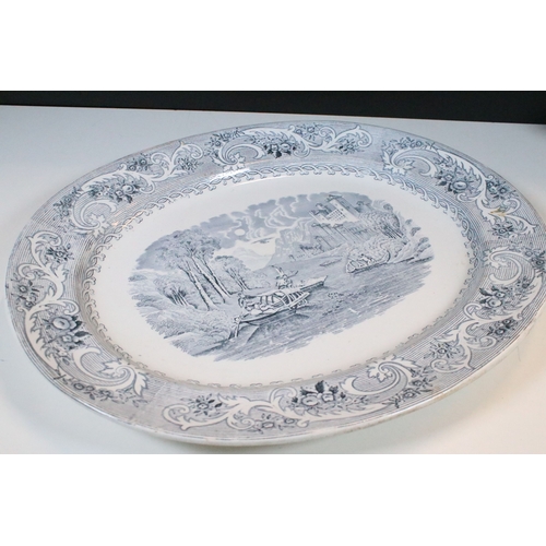 28 - Early 20th century transferware grey and white oval meat platter charger 45cm, together with two sau... 