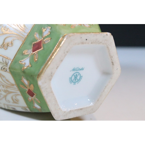 33 - Japanese Noritake items to include an ornate vase together with a pair of two handled vases with han... 