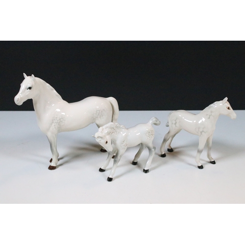47 - Group of three white Beswick horses to include two foals and Welsh Mountain pony examples (3)
