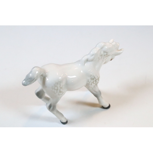 47 - Group of three white Beswick horses to include two foals and Welsh Mountain pony examples (3)