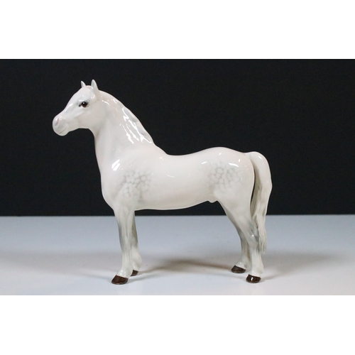47 - Group of three white Beswick horses to include two foals and Welsh Mountain pony examples (3)