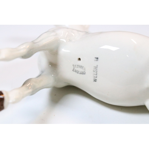 47 - Group of three white Beswick horses to include two foals and Welsh Mountain pony examples (3)