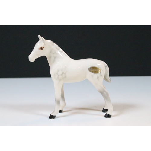 47 - Group of three white Beswick horses to include two foals and Welsh Mountain pony examples (3)