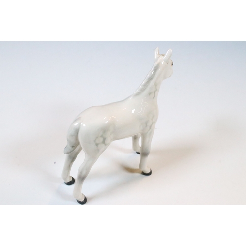 47 - Group of three white Beswick horses to include two foals and Welsh Mountain pony examples (3)