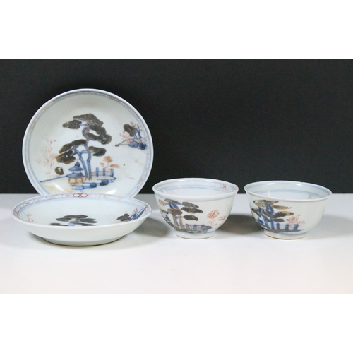 53 - Two Chinese The Nanking Cargo ceramic tea cup and saucers with blue and white scenes and detailed de... 