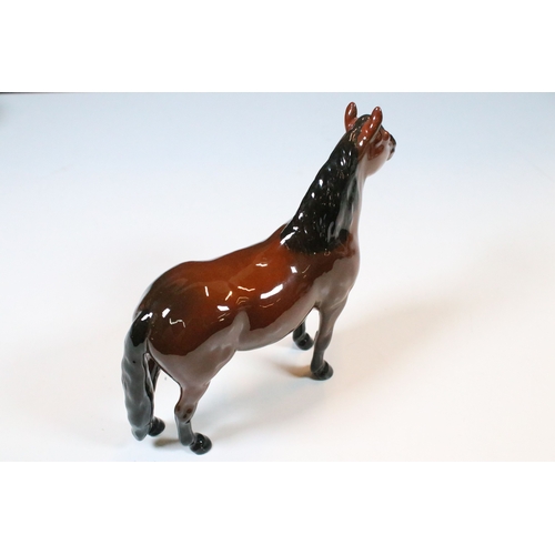 54 - Group of four Beswick horse figurines to include Dartmoor, Warlord and a white pony example in a hig... 