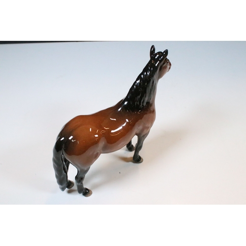 54 - Group of four Beswick horse figurines to include Dartmoor, Warlord and a white pony example in a hig... 