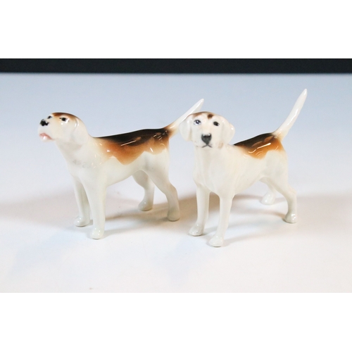 7 - Beswick hunt figurines to include huntsman, huntswoman and seven hounds (9)