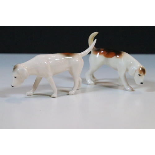 7 - Beswick hunt figurines to include huntsman, huntswoman and seven hounds (9)