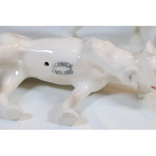 7 - Beswick hunt figurines to include huntsman, huntswoman and seven hounds (9)