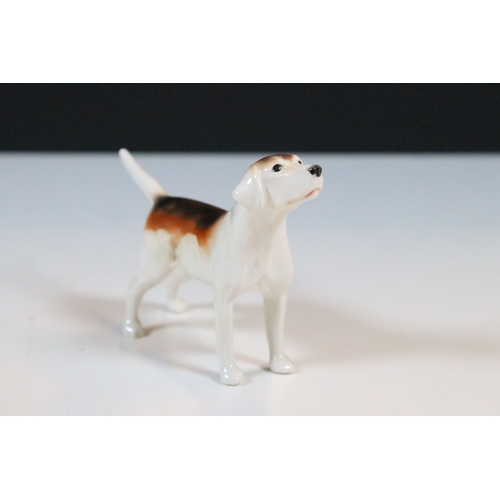 7 - Beswick hunt figurines to include huntsman, huntswoman and seven hounds (9)