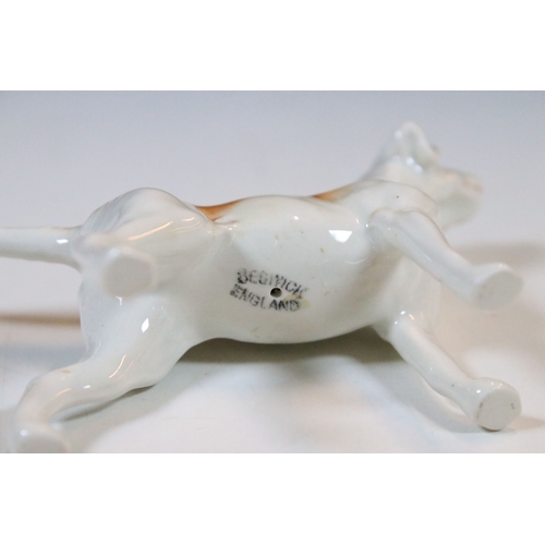 7 - Beswick hunt figurines to include huntsman, huntswoman and seven hounds (9)