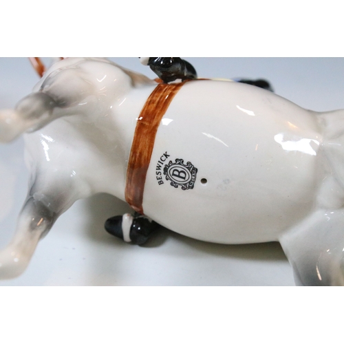 7 - Beswick hunt figurines to include huntsman, huntswoman and seven hounds (9)