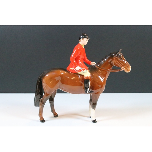 7 - Beswick hunt figurines to include huntsman, huntswoman and seven hounds (9)