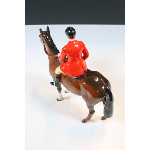 7 - Beswick hunt figurines to include huntsman, huntswoman and seven hounds (9)