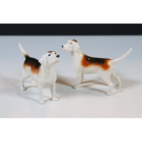 7 - Beswick hunt figurines to include huntsman, huntswoman and seven hounds (9)