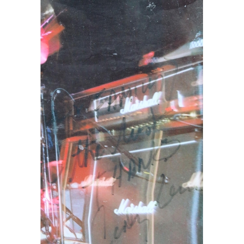 21 - Memorabilia - Framed and glazed picture of Mountain signed by Corky Laing and dedicated to The Bell ... 