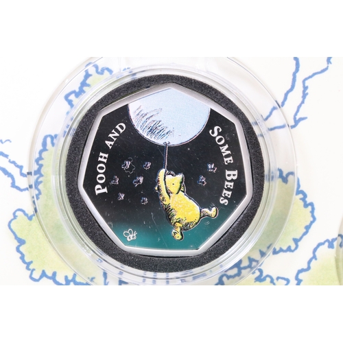 244 - A Bradford Exchange Winnie the Pooh 50p coin set to include three solid 24ct gold examples with colo... 