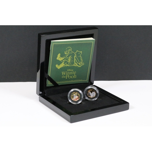 244 - A Bradford Exchange Winnie the Pooh 50p coin set to include three solid 24ct gold examples with colo... 