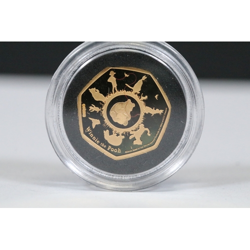 244 - A Bradford Exchange Winnie the Pooh 50p coin set to include three solid 24ct gold examples with colo... 