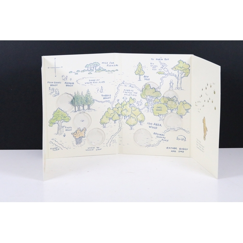 244 - A Bradford Exchange Winnie the Pooh 50p coin set to include three solid 24ct gold examples with colo... 