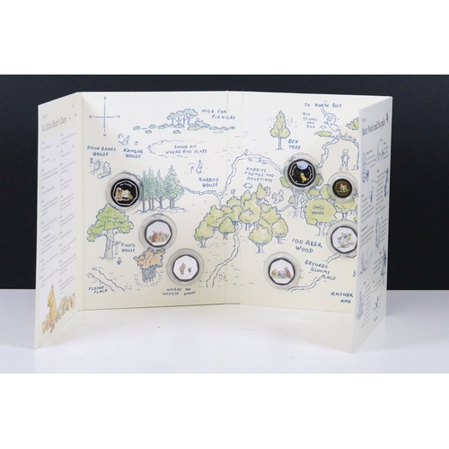 244 - A Bradford Exchange Winnie the Pooh 50p coin set to include three solid 24ct gold examples with colo... 