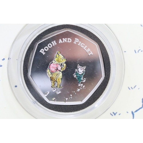244 - A Bradford Exchange Winnie the Pooh 50p coin set to include three solid 24ct gold examples with colo... 