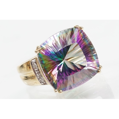 58 - 9ct gold and mystic topaz dress ring being set with a cushion cut mystic topaz to the head. Hallmark... 