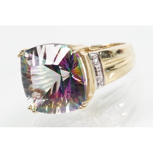 58 - 9ct gold and mystic topaz dress ring being set with a cushion cut mystic topaz to the head. Hallmark... 