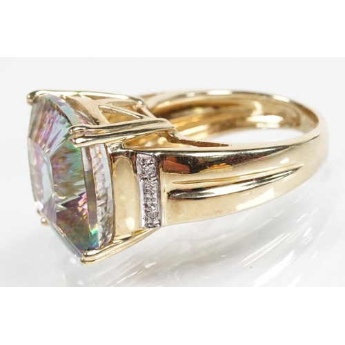 58 - 9ct gold and mystic topaz dress ring being set with a cushion cut mystic topaz to the head. Hallmark... 