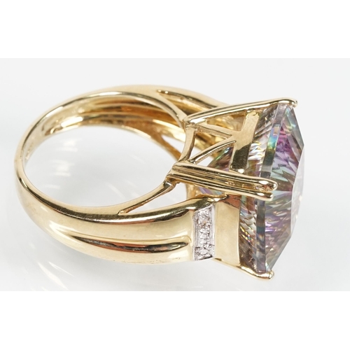 58 - 9ct gold and mystic topaz dress ring being set with a cushion cut mystic topaz to the head. Hallmark... 