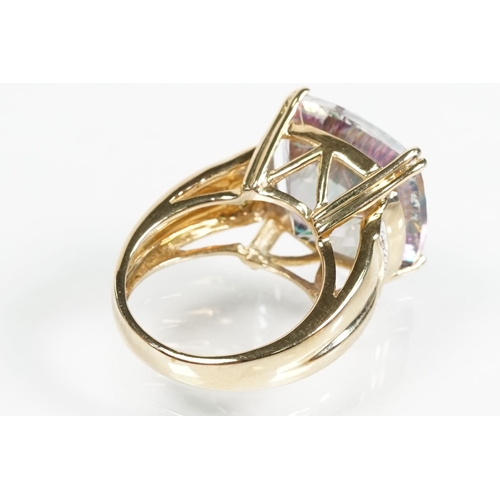 58 - 9ct gold and mystic topaz dress ring being set with a cushion cut mystic topaz to the head. Hallmark... 