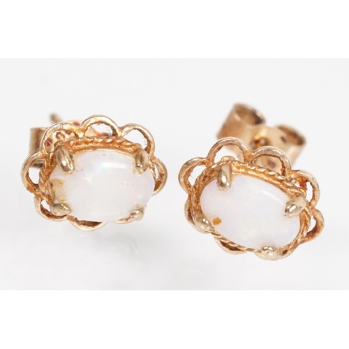 144 - Collection of 9ct gold and yellow metal stud earrings to include a pair of opal studs, coral studs, ... 