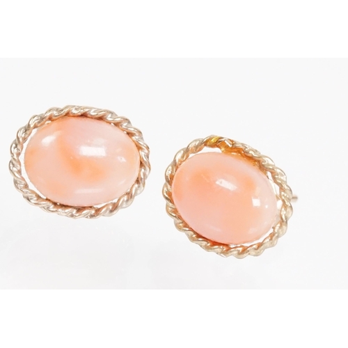 144 - Collection of 9ct gold and yellow metal stud earrings to include a pair of opal studs, coral studs, ... 