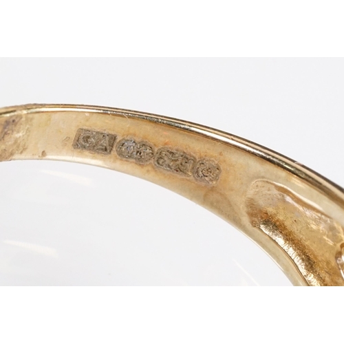 147 - 9ct gold and garnet three stone ring being set with three oval cut garnets in a pierced mount settin... 