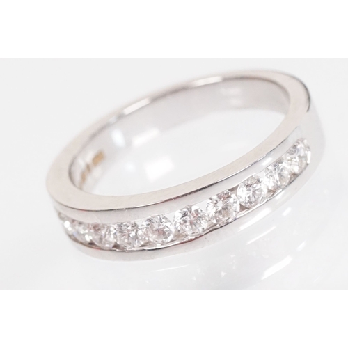 15 - 18ct white gold and diamond half eternity ring. The ring being set with ten round brilliant cut diam... 
