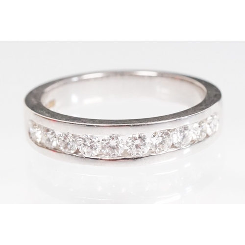 15 - 18ct white gold and diamond half eternity ring. The ring being set with ten round brilliant cut diam... 