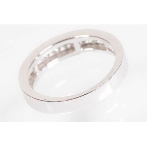15 - 18ct white gold and diamond half eternity ring. The ring being set with ten round brilliant cut diam... 