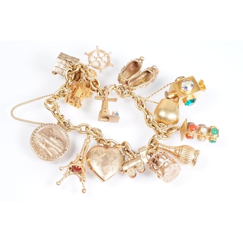 163 - 18ct gold charm bracelet having a curb link chain and spring ring clasp (marked 750), traffic light ... 