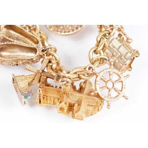 163 - 18ct gold charm bracelet having a curb link chain and spring ring clasp (marked 750), traffic light ... 