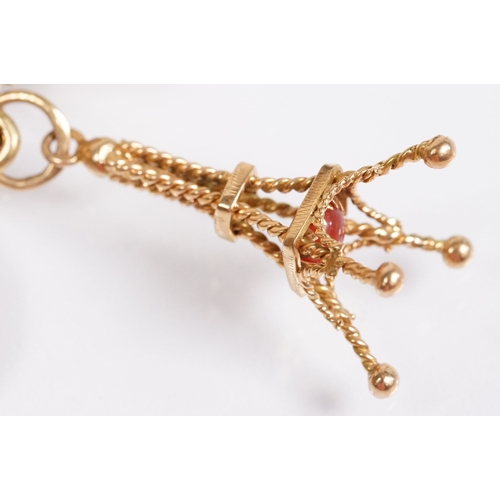 163 - 18ct gold charm bracelet having a curb link chain and spring ring clasp (marked 750), traffic light ... 