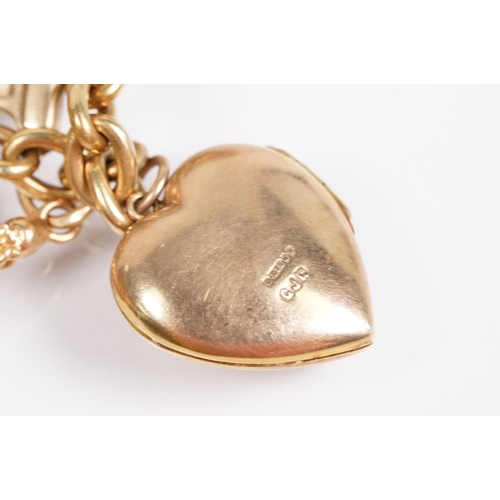 163 - 18ct gold charm bracelet having a curb link chain and spring ring clasp (marked 750), traffic light ... 