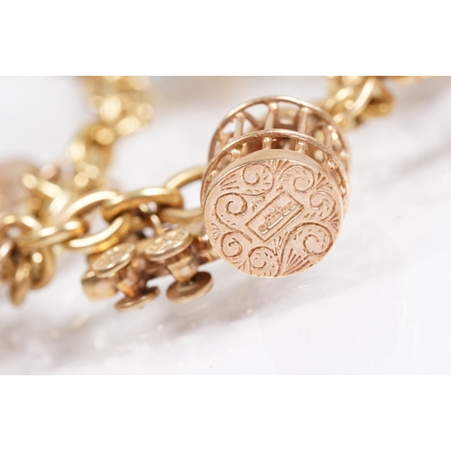 163 - 18ct gold charm bracelet having a curb link chain and spring ring clasp (marked 750), traffic light ... 